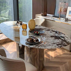 Elliptical white marble effect dining table with anti-stain and scratch-tolerant finish, seats 6 to 8