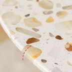 Modern terrazzo dining table with sleek design, perfect for cozy meals and home office use