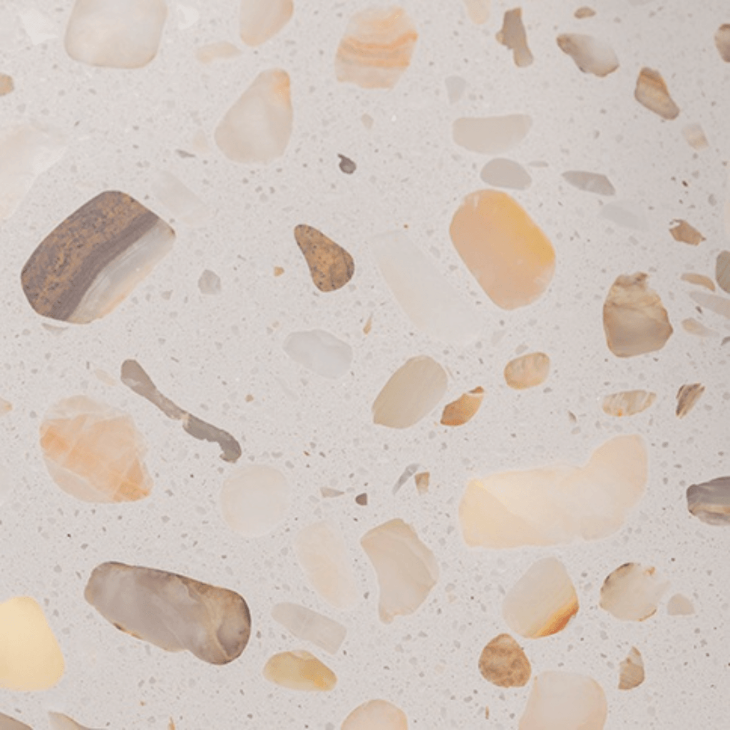 Round side table with vibrant red terrazzo top, featuring a modern minimalist design