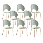 Stackable Scandinavian style dining chair with plastic seat, acrylic back, and silver legs