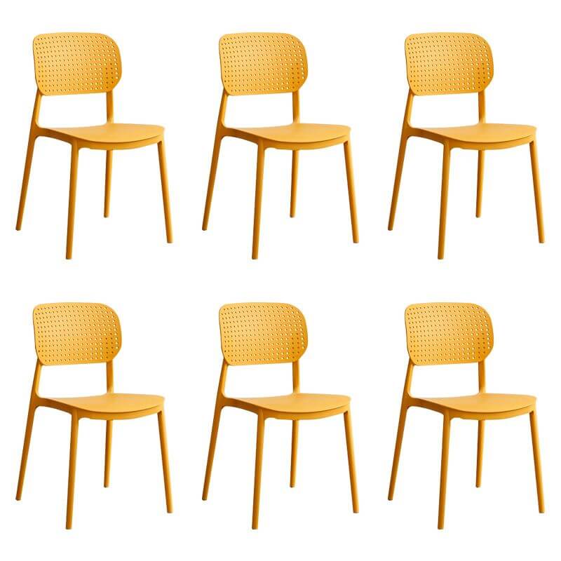 Stackable Scandinavian style plastic and acrylic side chair with low back for dining