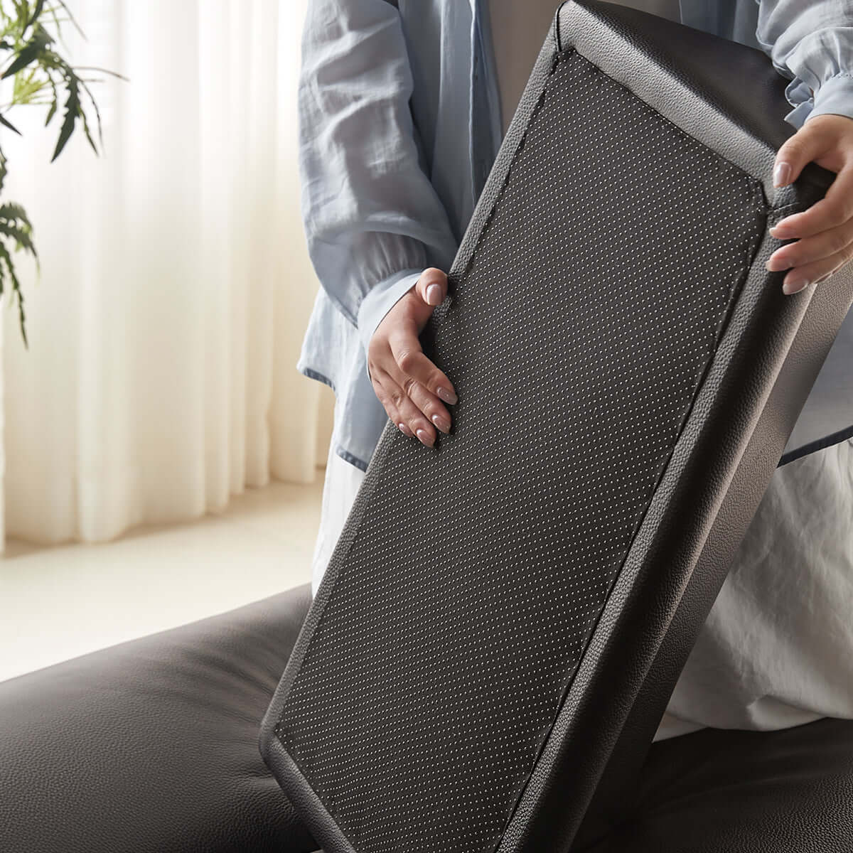 Double sided leather upholstered sofa designed for living room comfort and style