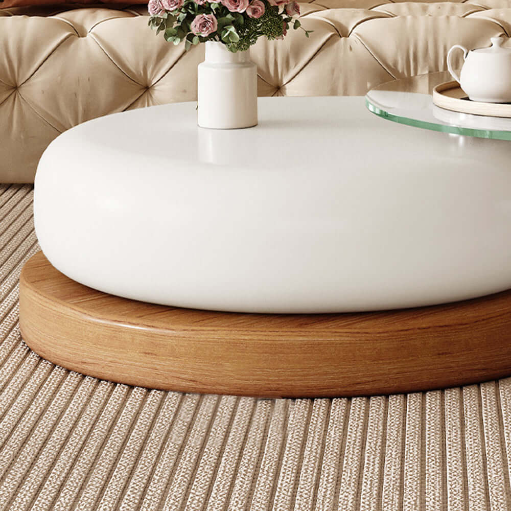 Round coffee table with glass top and solid wood legs, perfect for modern living rooms