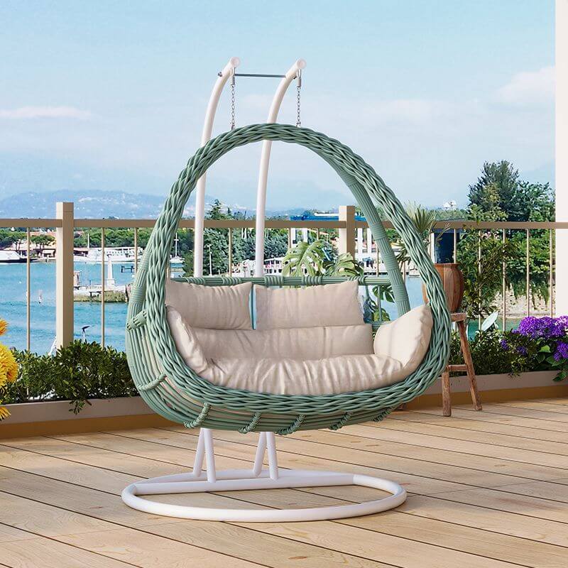 Pink metal 2-seater porch swing with stand, chain, and cushions for outdoor seating