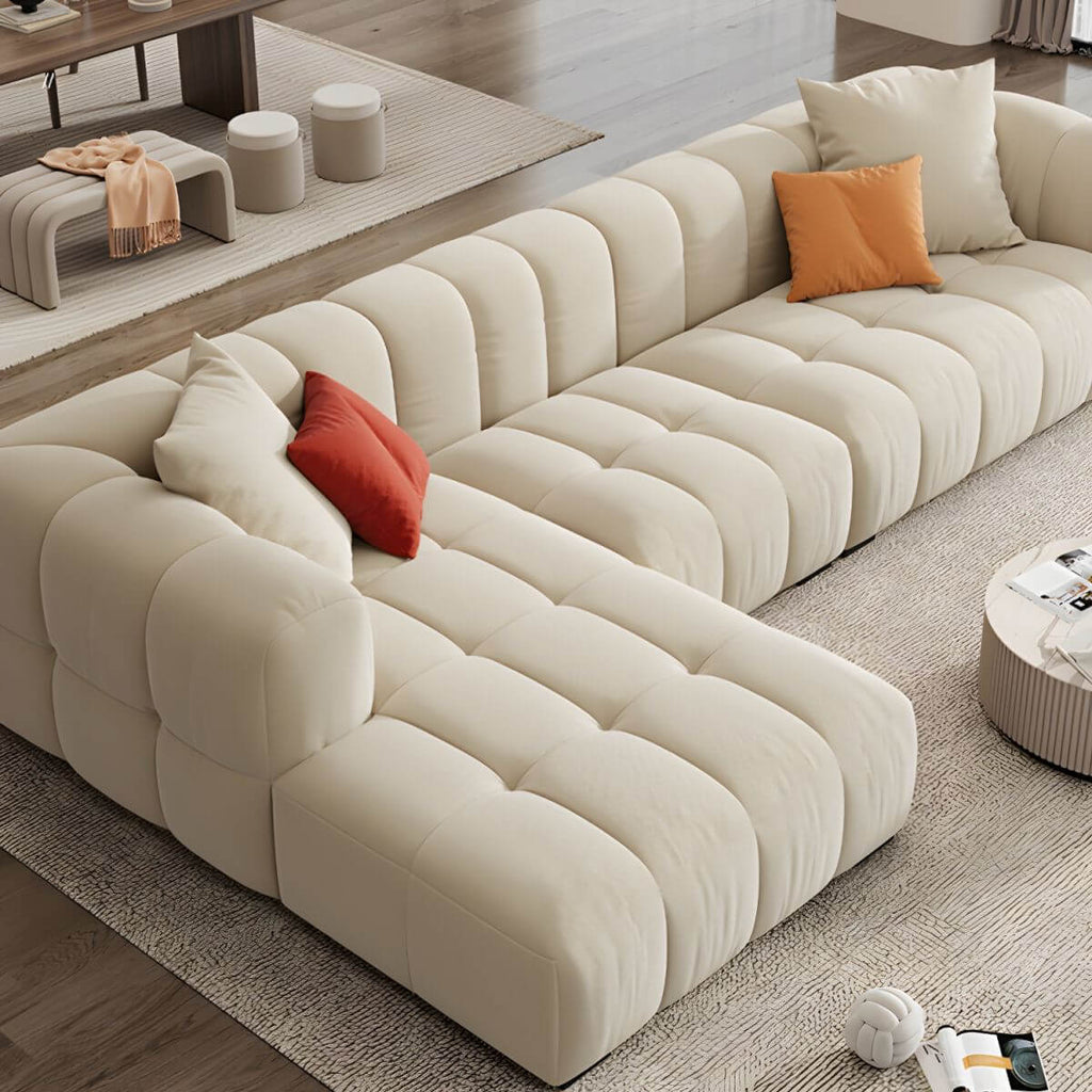 Beige upholstered wood sofa with square arms and sewn pillow back for modern living rooms