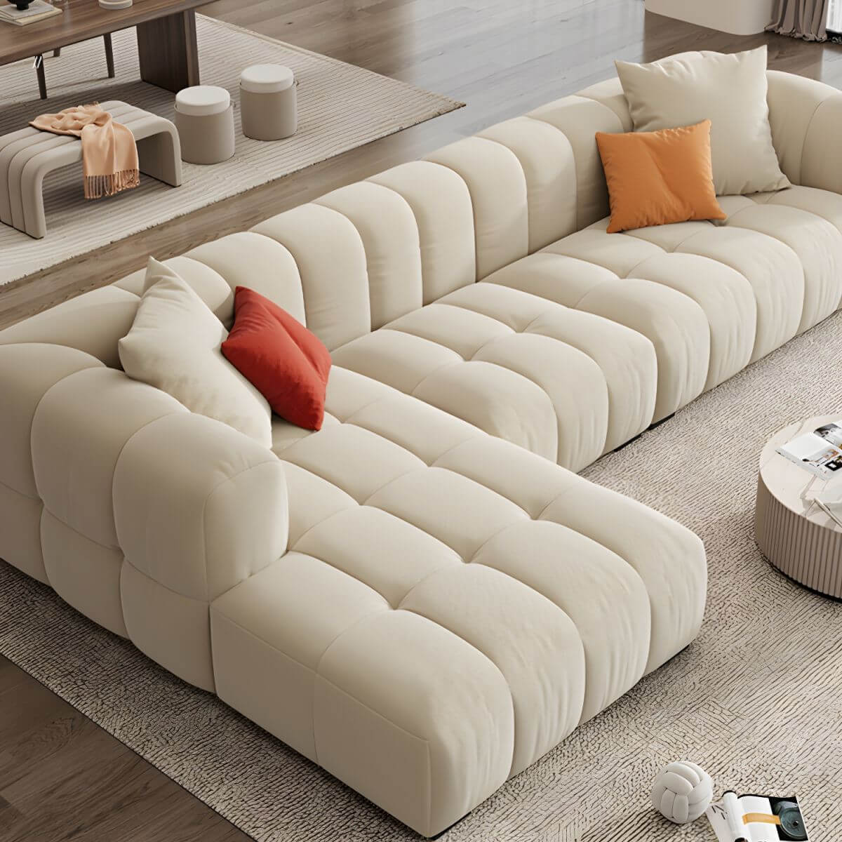 Beige upholstered wood sofa with square arms and sewn pillow back for modern living rooms