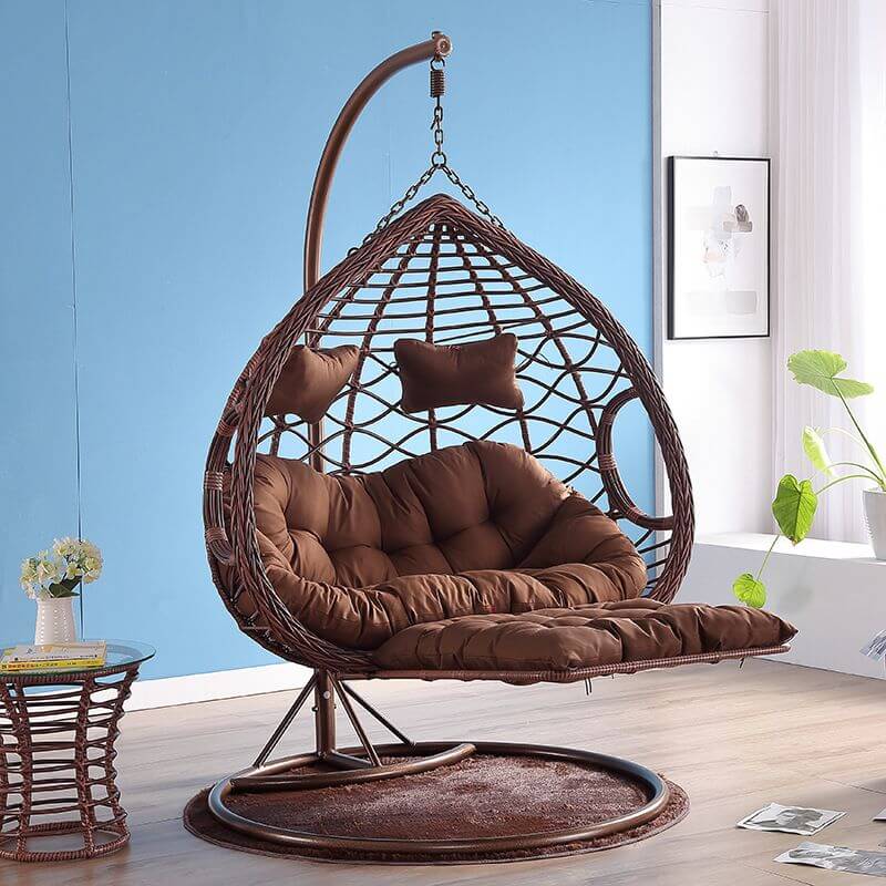 Metal porch swing with cushions, chain, and stand, designed to be heat resistant for outdoor use