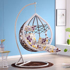 Metal porch swing with cushions, chain, and stand, designed to be heat resistant for outdoor use