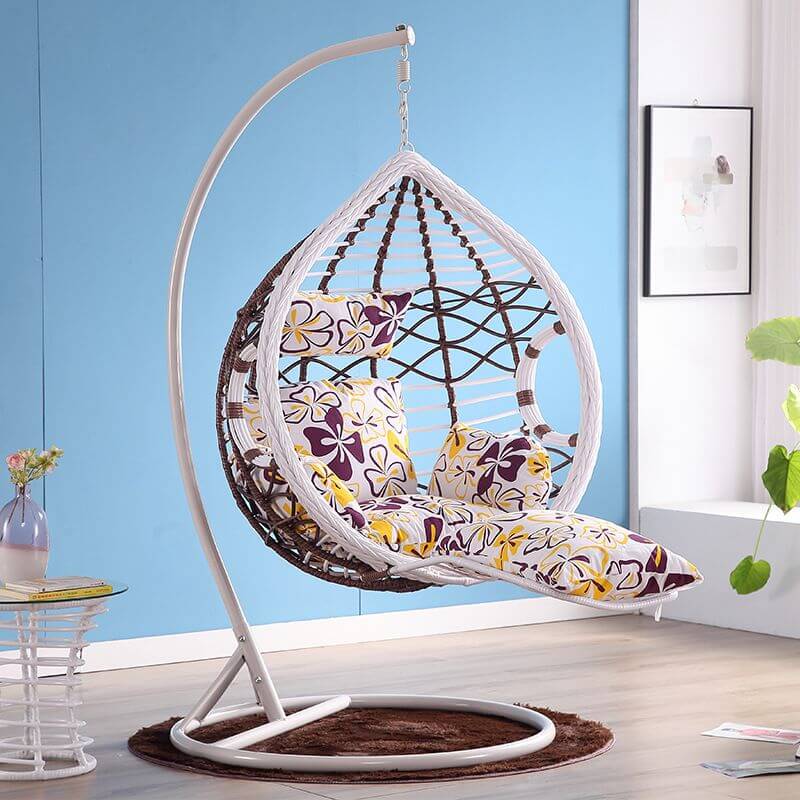 Metal porch swing with cushions, chain, and stand, designed to be heat resistant for outdoor use