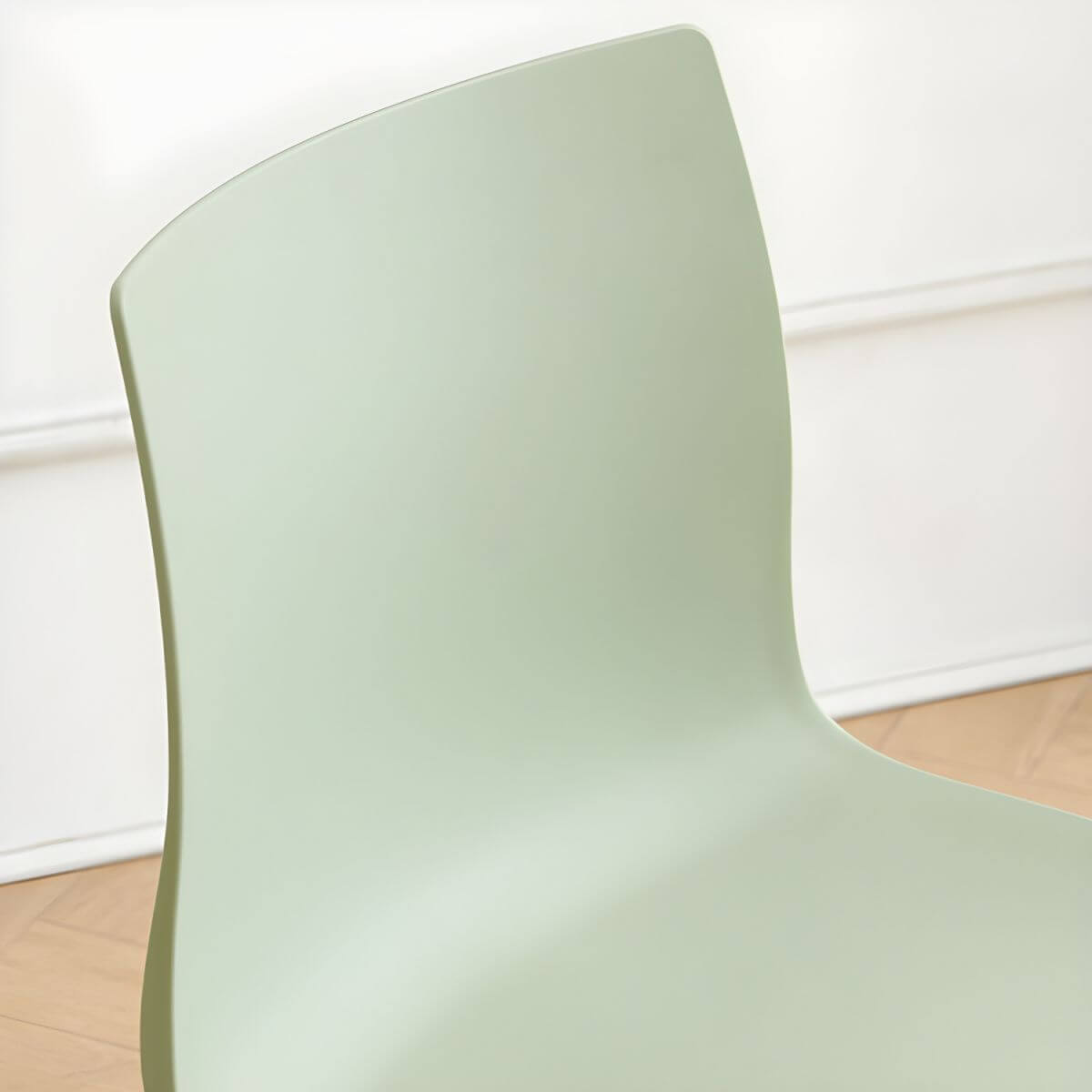 Modern plastic and acrylic side chair with metal legs, ideal for kitchen and dining rooms