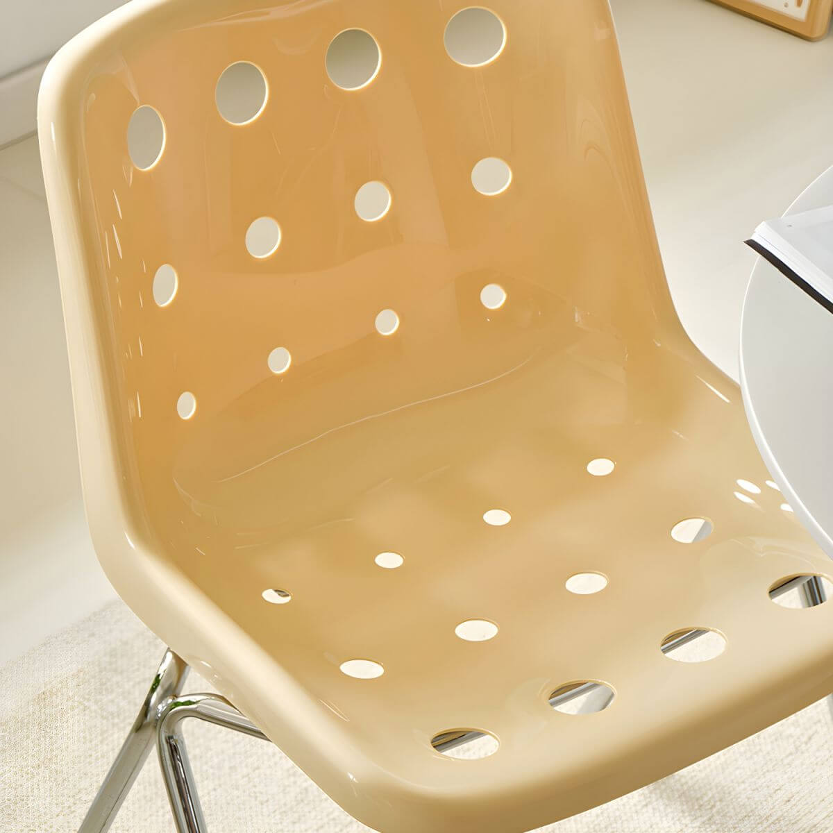 Stackable Scandinavian plastic and acrylic side chair with low back for dining