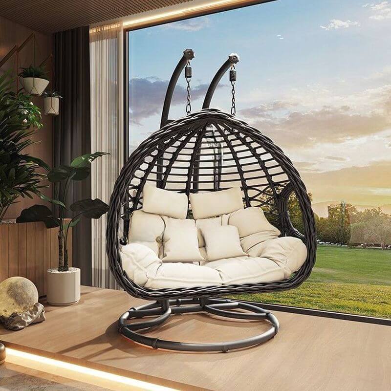 Porch swing with tropical ivory and auburn hydrophobic framed pads, metal stand and chain included