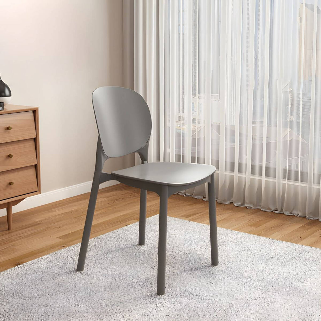 Stackable Scandinavian side chair with open back made of plastic and acrylic for dining