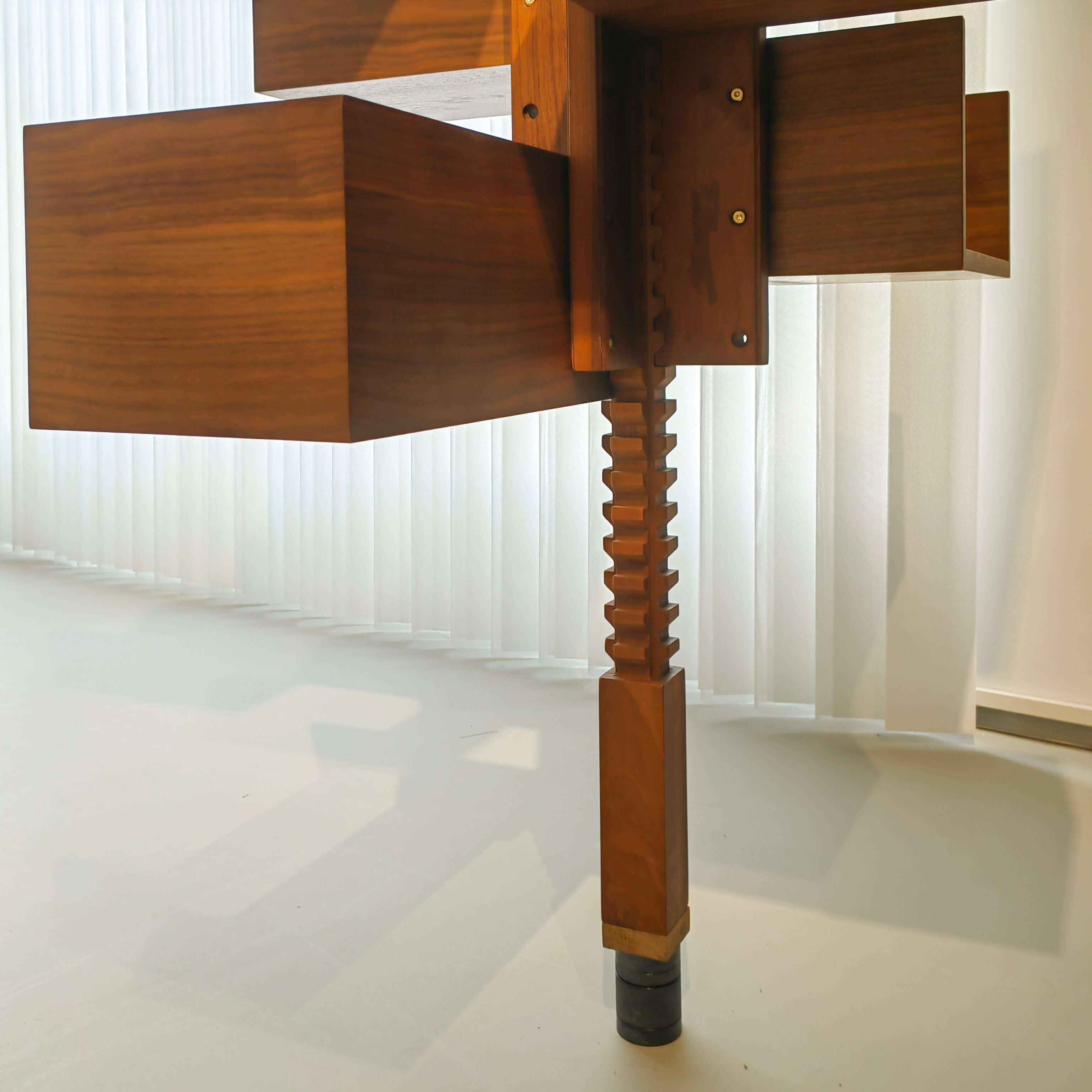 360-degree rotating walnut wood bookshelf extending from floor to ceiling for stylish storage