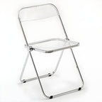Scandinavian style dining chair with silver metal legs and plastic acrylic seat
