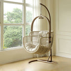 Tropical cocoa and cream upholstered porch swing with alloy frame, stand, and chain included