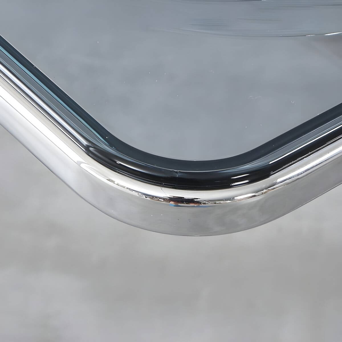 Scandinavian style dining chair with silver metal legs and plastic acrylic seat