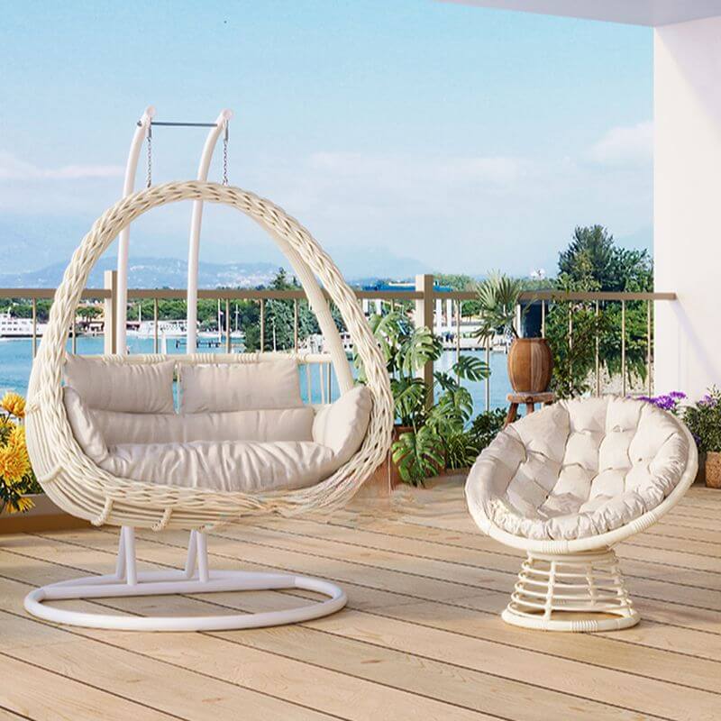 Pink metal 2-seater porch swing with stand, chain, and cushions for outdoor seating