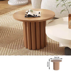 Modern circular coffee table set featuring fluted base in dual-tone finish