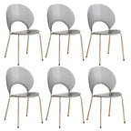 Stackable acrylic dining chair with open back and metal legs, armless design for modern dining rooms