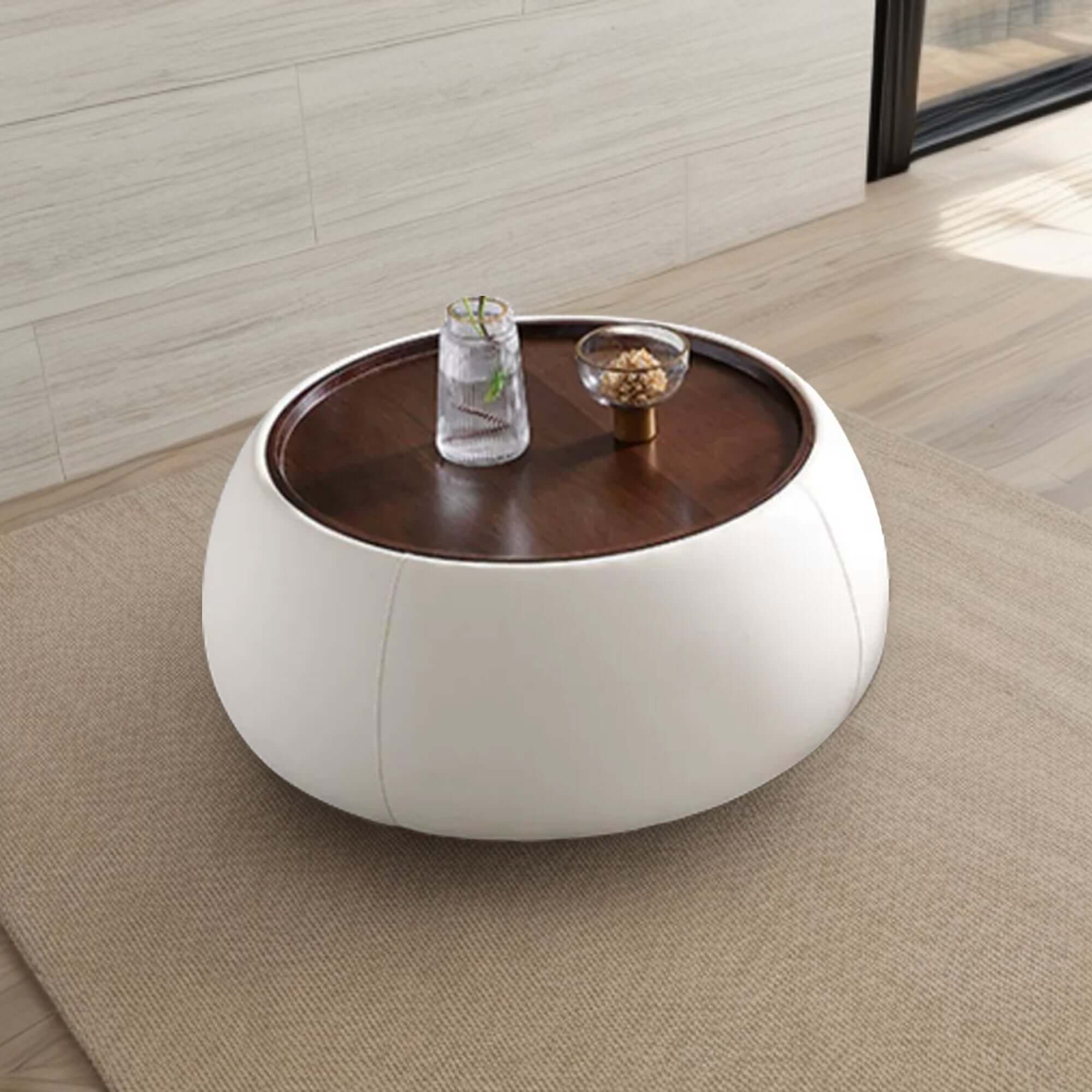 Modern round coffee table with storage, featuring a light luxury design