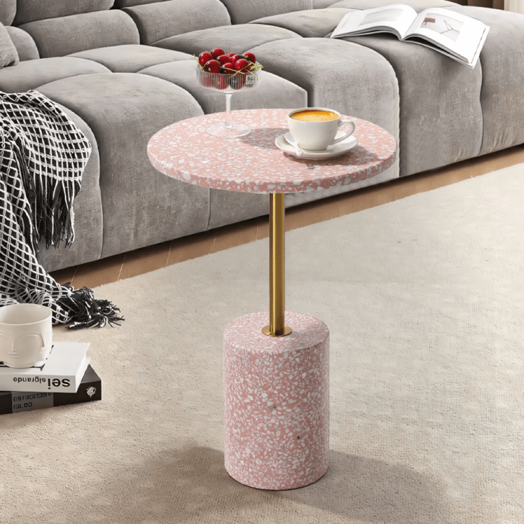 Pink terrazzo coffee table with gold accents in a modern minimalist design main product image Image principale du produit