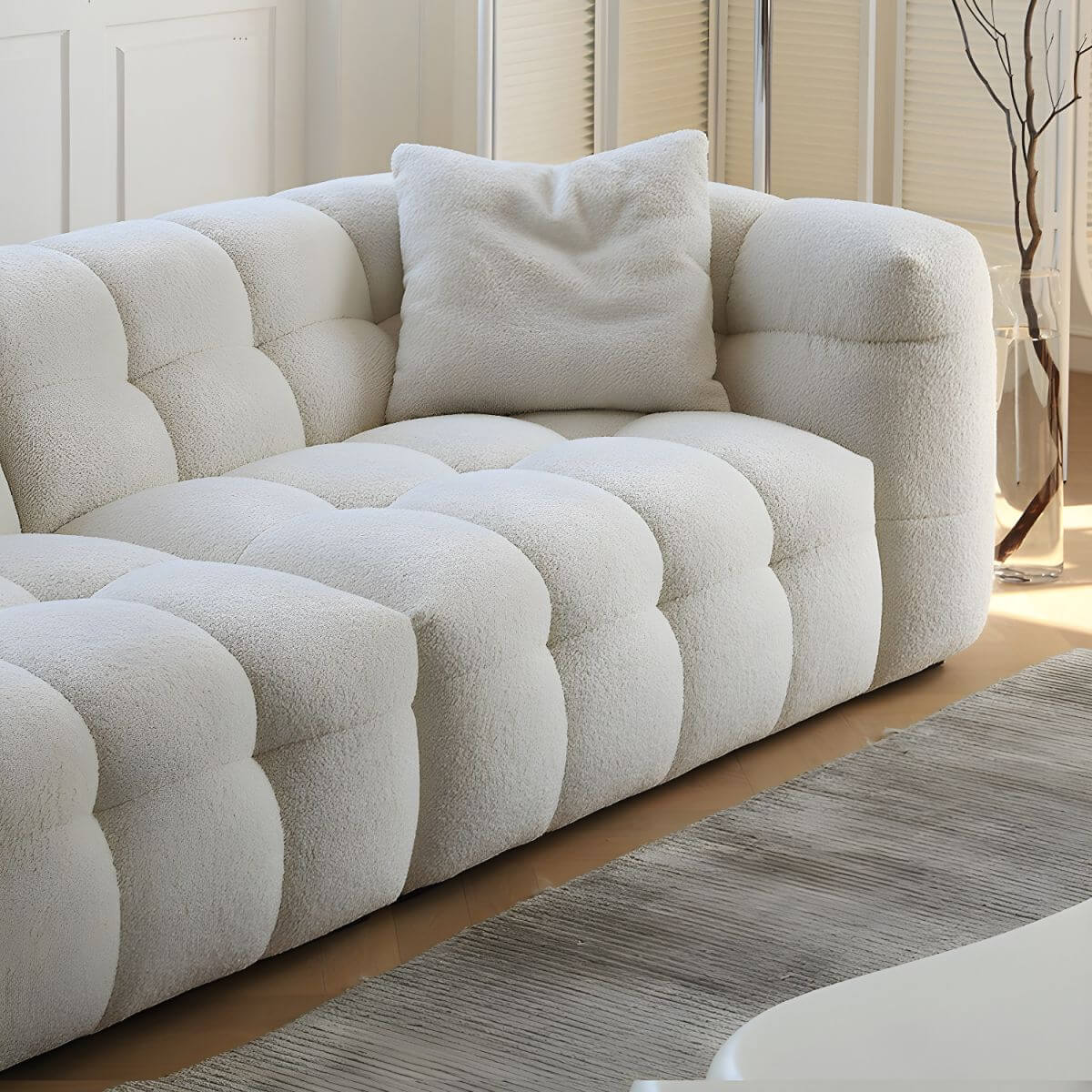 White fabric tuxedo arm sofa with biscuit back, 27.55 inches tall