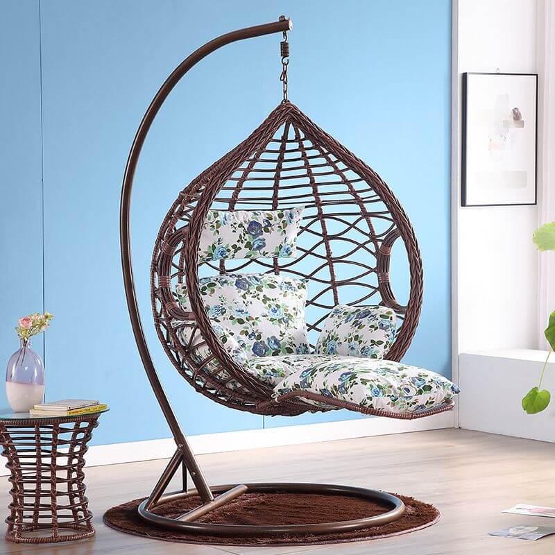 Metal porch swing with cushions, chain, and stand, designed to be heat resistant for outdoor use