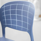 Stackable modern side chair with low back made of plastic and acrylic, perfect for contemporary dining