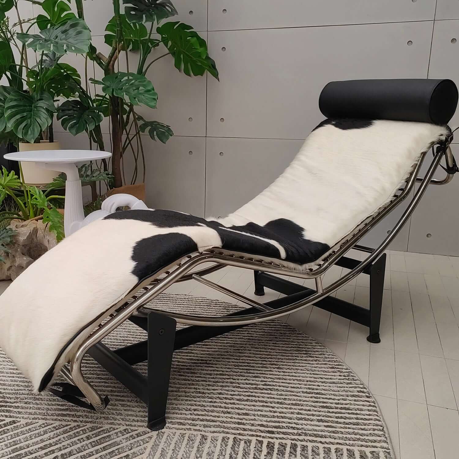 Adjustable chaise chair with curved steel frame, modern design for comfortable seating