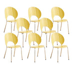 Stackable Scandinavian style dining chair with plastic seat, acrylic back, and silver legs