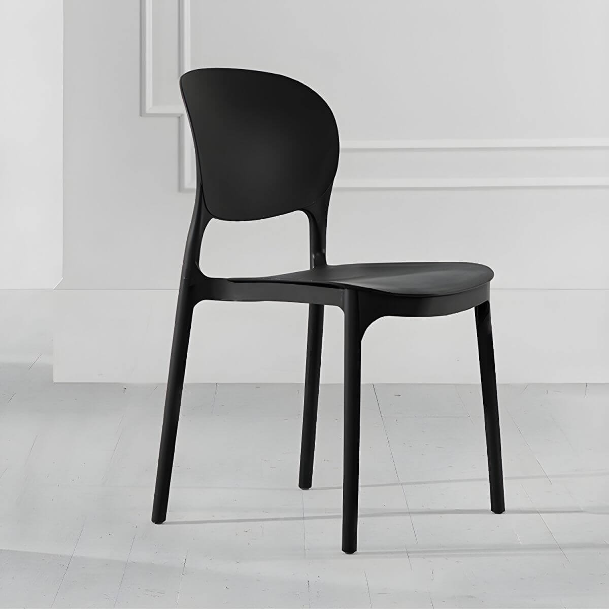 Stackable modern side chair with low back made of plastic and acrylic, perfect for contemporary dining