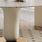 Round terrazzo dining table featuring a stylish wooden and metal base for elegant interiors