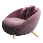 Scandinavian papasan chair with fixed back, sloped arms, cotton blend fabric, and 2 pillows