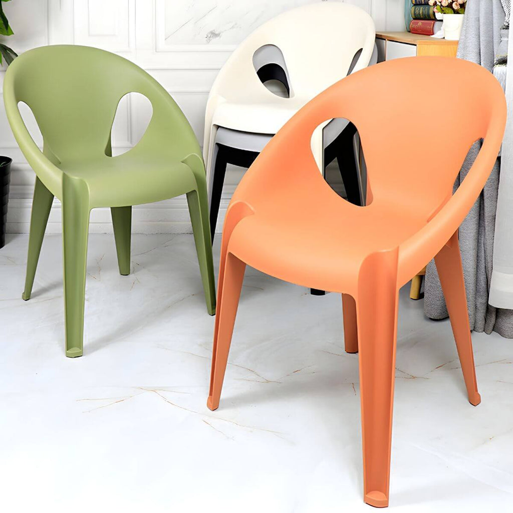 Stackable modern arm chair with open back made of plastic and acrylic for dining