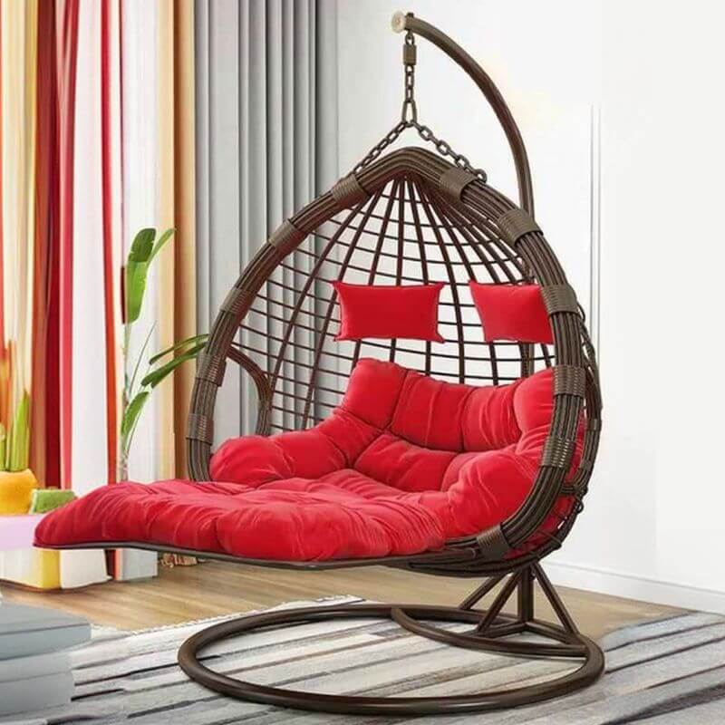 Two-seater metal porch swing egg chair with stand, cushions, and chain included