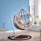 Metal porch swing with cushions, chain, and stand, designed to be heat resistant for outdoor use