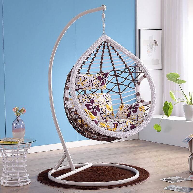 Metal porch swing with cushions, chain, and stand, designed to be heat resistant for outdoor use