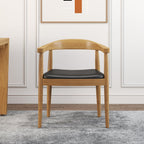 Set of four modern curved back dining chairs with walnut wooden frame and upholstered leather seats