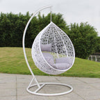 Metal porch swing with stand, cushions, and chain for comfortable outdoor seating