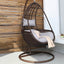 Metal porch swing with tropical olive green, auburn, and rose cushions, includes stand and chain