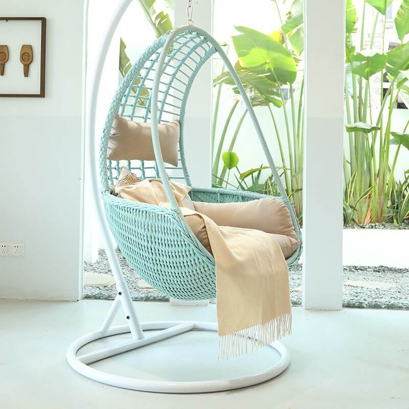 Metal porch swing with tropical olive green, auburn, and rose cushions, includes stand and chain