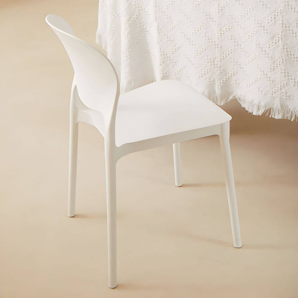 Stackable modern side chair with low back made of plastic and acrylic, perfect for contemporary dining