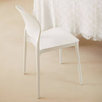 Stackable modern side chair with low back made of plastic and acrylic, perfect for contemporary dining