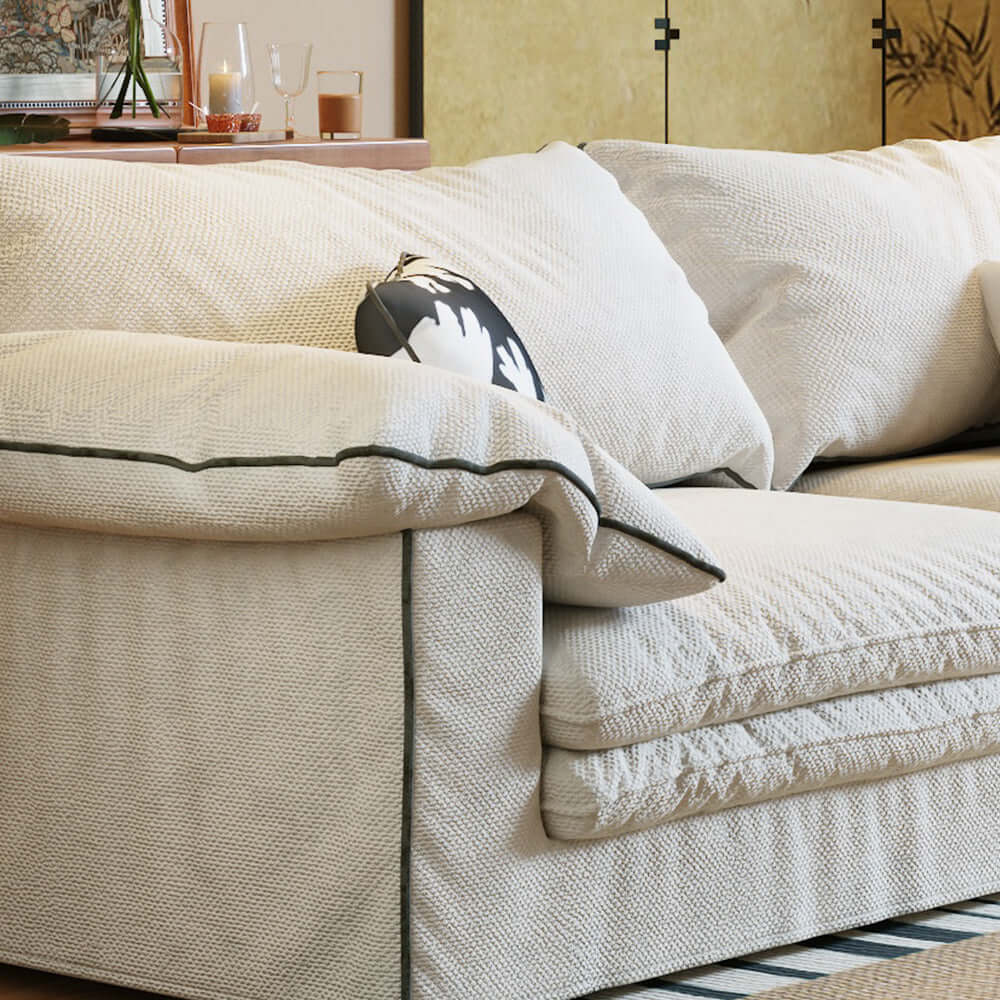 Beige cotton linen sofa with removable and washable fabric cover for easy maintenance