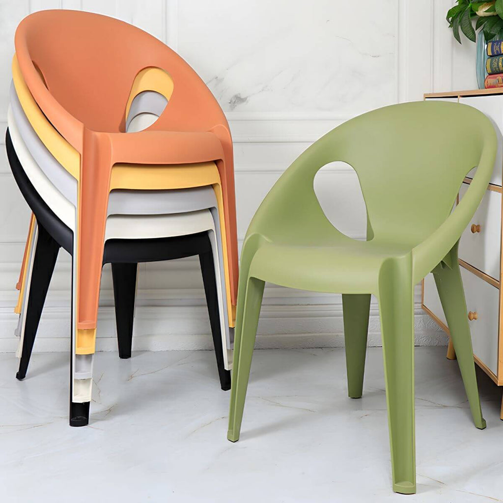 Stackable modern arm chair with open back made of plastic and acrylic for dining