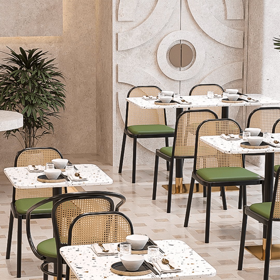 Rattan dining chairs with durable terrazzo table for an elegant dining setup