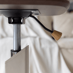 Movable end table in classic beige saddle leather, perfect for cozy living spaces