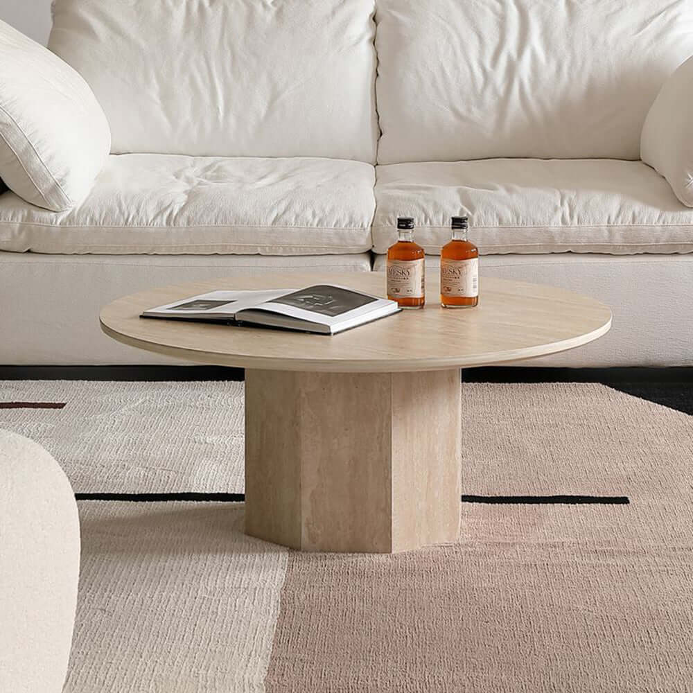 Round Japandi coffee table with beige travertine top and premium wood base
