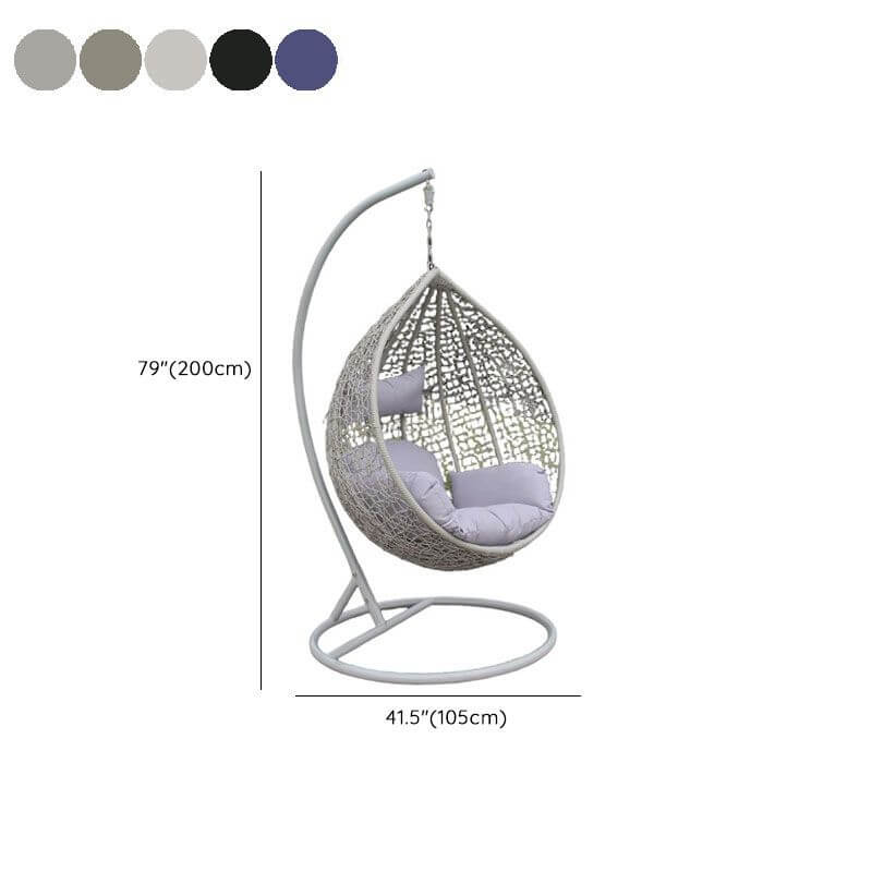 Metal porch swing with stand, cushions, and chain for comfortable outdoor seating